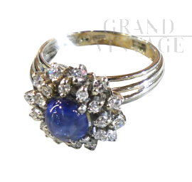Platinum ring with cabochon sapphire and diamonds 