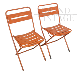 Pair of orange metal garden chairs, 1970s