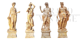 Group of 4 statues depicting the Four Seasons in travertine marble