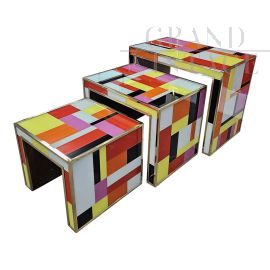 Trio of nesting tables in colored glass