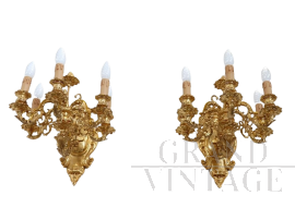 Pair of chiseled gilt bronze wall lights in antique style
