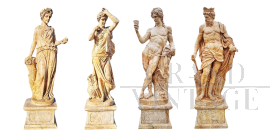 Group of 4 statues depicting the Four Seasons in travertine marble