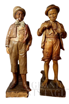 The rich kid and the poor kid - terracotta sculptures by Friederich Goldscheider