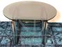 Round space age table in steel and glass