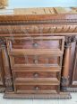 Living room set with buffet & hutch cupboard and a sideboard, all carved with statues