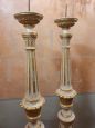 Pair of lacquered and gilded wooden candlesticks