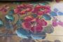 4 nesting tables with flowers painted on the top