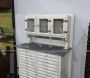 Vintage high cupboard in white wood with small drawers and marble top