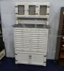 Vintage high cupboard in white wood with small drawers and marble top   