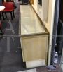 Large vintage sideboard covered in fabric, glass and brass