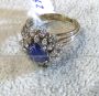 Platinum ring with cabochon sapphire and diamonds