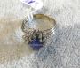 Platinum ring with cabochon sapphire and diamonds