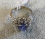 Platinum ring with cabochon sapphire and diamonds