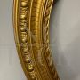 Pair of antique carved and gilded oval frames