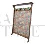 Vintage hallway coat rack covered in floral fabric