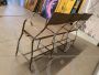 Vintage industrial metal bench with folding seats