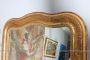 Large antique gilded mirror with a wavy shape