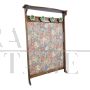 Vintage hallway coat rack covered in floral fabric