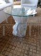 Vintage ethnic style coffee table with white ceramic lion base and glass top