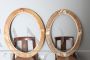 Pair of antique carved and gilded oval frames