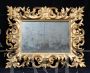 Antique Florentine mirror with large gilded and carved wooden frame