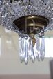 Antique chandelier from the late 19th century in gilded bronze with crystal drops