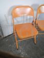 Set of 3 orange metal folding chairs, 1970s