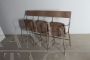 Vintage industrial metal bench with folding seats