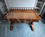 Antique desk in light mahogany with railing on the top             