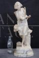 Sculpture of a girl playing tennis in white marble, early decades of the 20th century