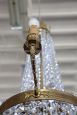 Antique chandelier from the late 19th century in gilded bronze with crystal drops