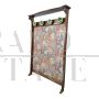 Vintage hallway coat rack covered in floral fabric