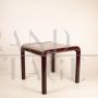 Orsay 54A table by Gae Aulenti for Knoll with glass top, burgundy color