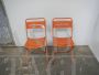 Pair of orange metal garden chairs, 1970s