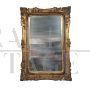 Gilded wooden mirror with floral decorations