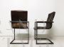 Pair of vintage style cantilever chairs in brown leather