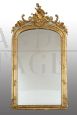 Antique Napoleon III mirror in gilded wood and carved with rocailles and roses