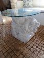 Vintage ethnic style coffee table with white ceramic lion base and glass top