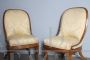 Antique pair of Charles X armchairs in walnut with cream damask fabric