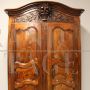 Antique Louis XV wardrobe or cupboard in walnut and cherry with carvings, 18th century