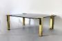 Design coffee table in brass and black glass, 1970s                            