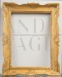 Antique Neapolitan Empire frame in gilded wood, carved and shaped