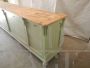 Vintage shop counter and shelving unit in green paint