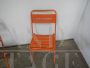 Pair of orange metal garden chairs, 1970s