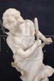 Sculpture of a girl playing tennis in white marble, early decades of the 20th century