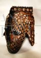 Antique African tribal mask with beads and leopard skin