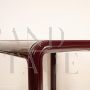 Orsay 54A table by Gae Aulenti for Knoll with glass top, burgundy color