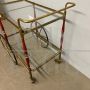 Cesare Lacca serving trolley in brass, glass and burgundy lacquered wood