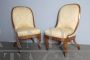 Antique pair of Charles X armchairs in walnut with cream damask fabric