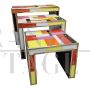 Trio of nesting tables in colored glass